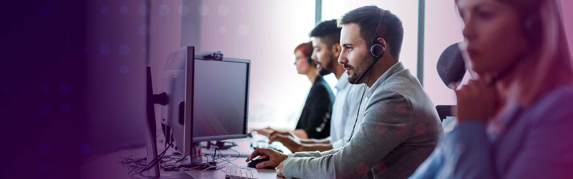 NCS IT employees working on computers