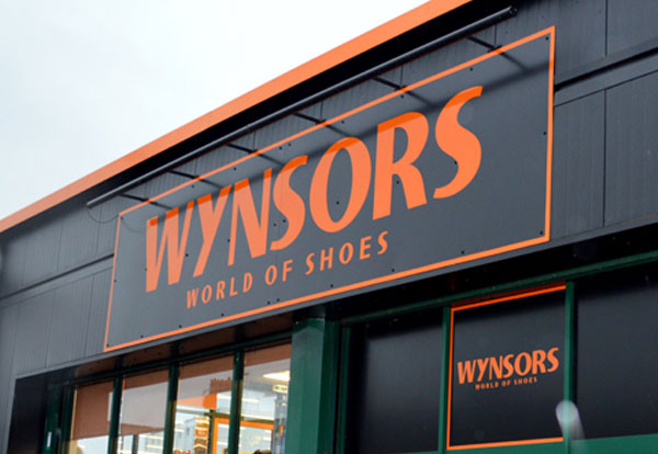 Close-up of logo on a Wynsors World of Shoes building